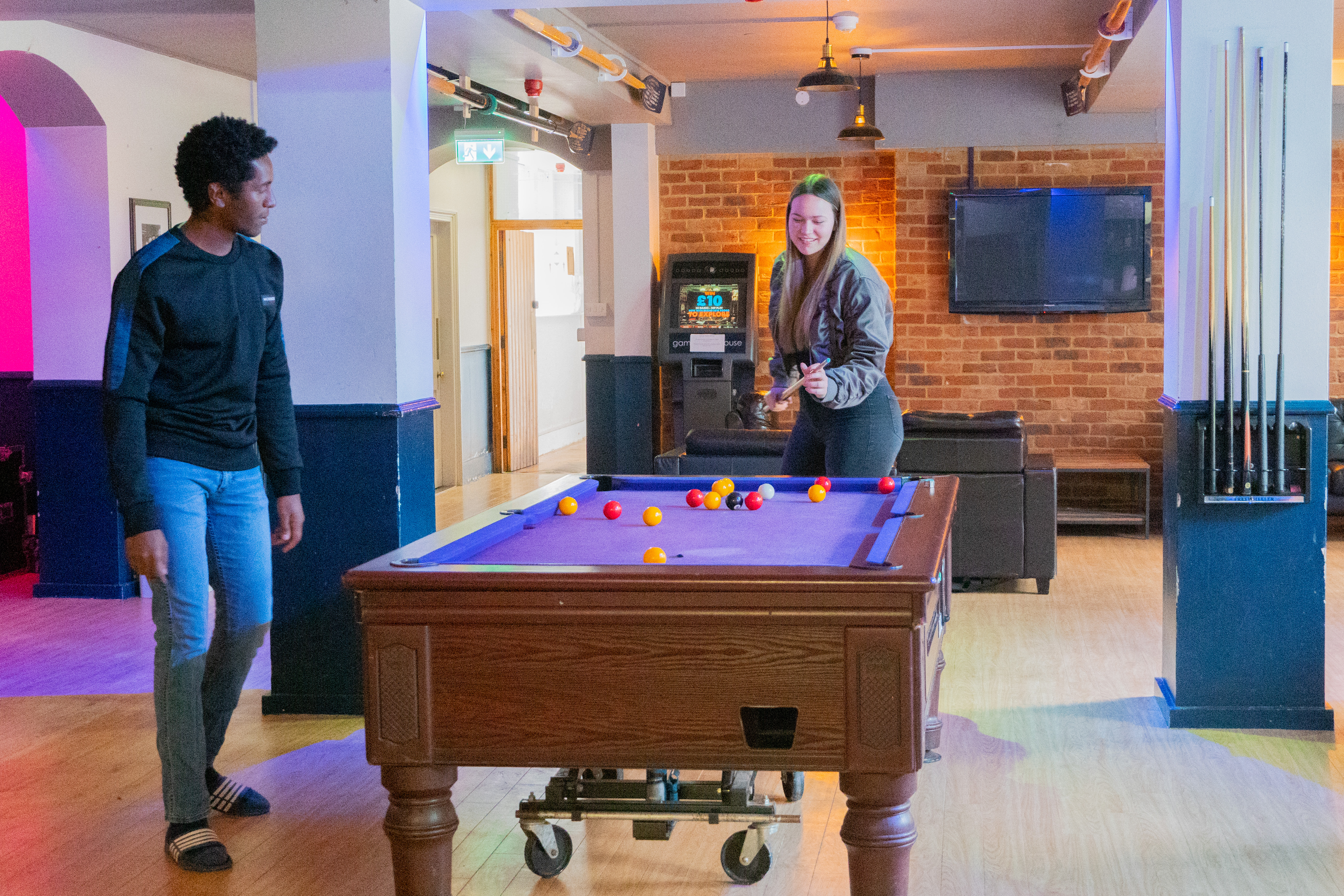 Students playing pool in the LMH Bar
