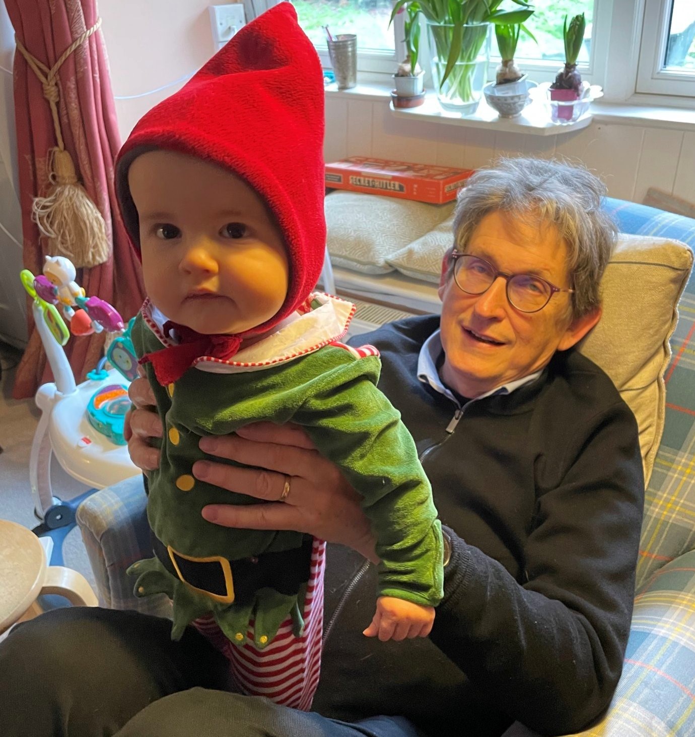 Photo of Alan Rusbridger sitting in a chair with his grandson