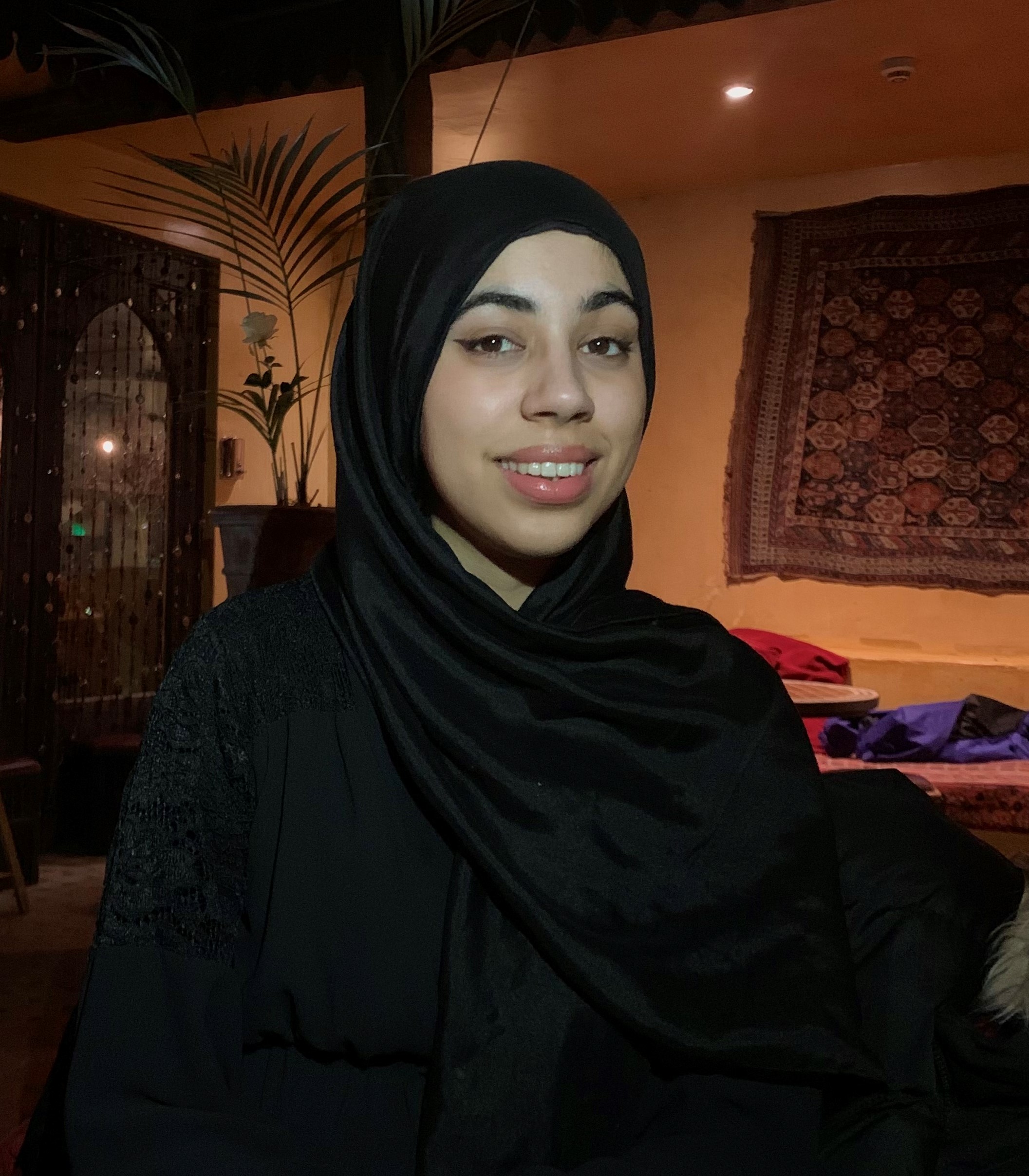 Photo of Aneela Shah, who wears a black hijab