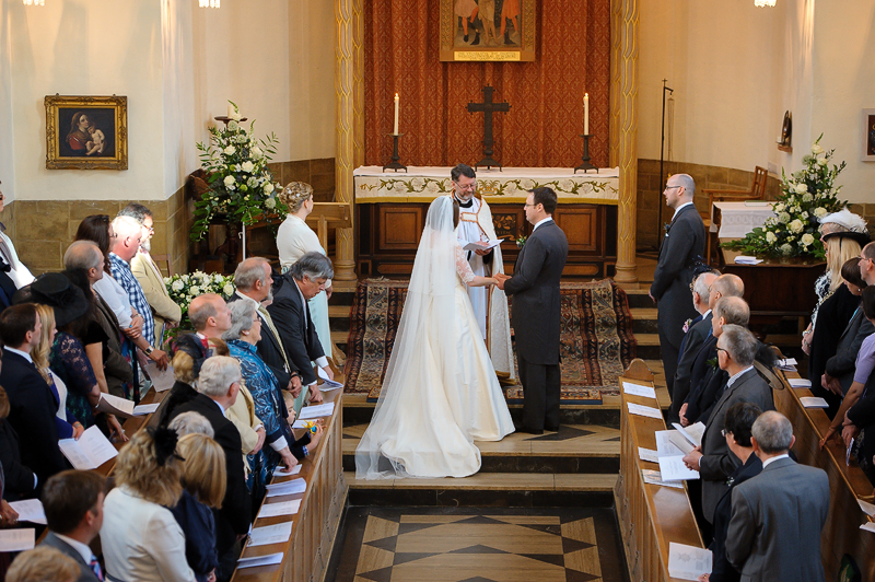 A man and a woman being married in the LMH Chapel