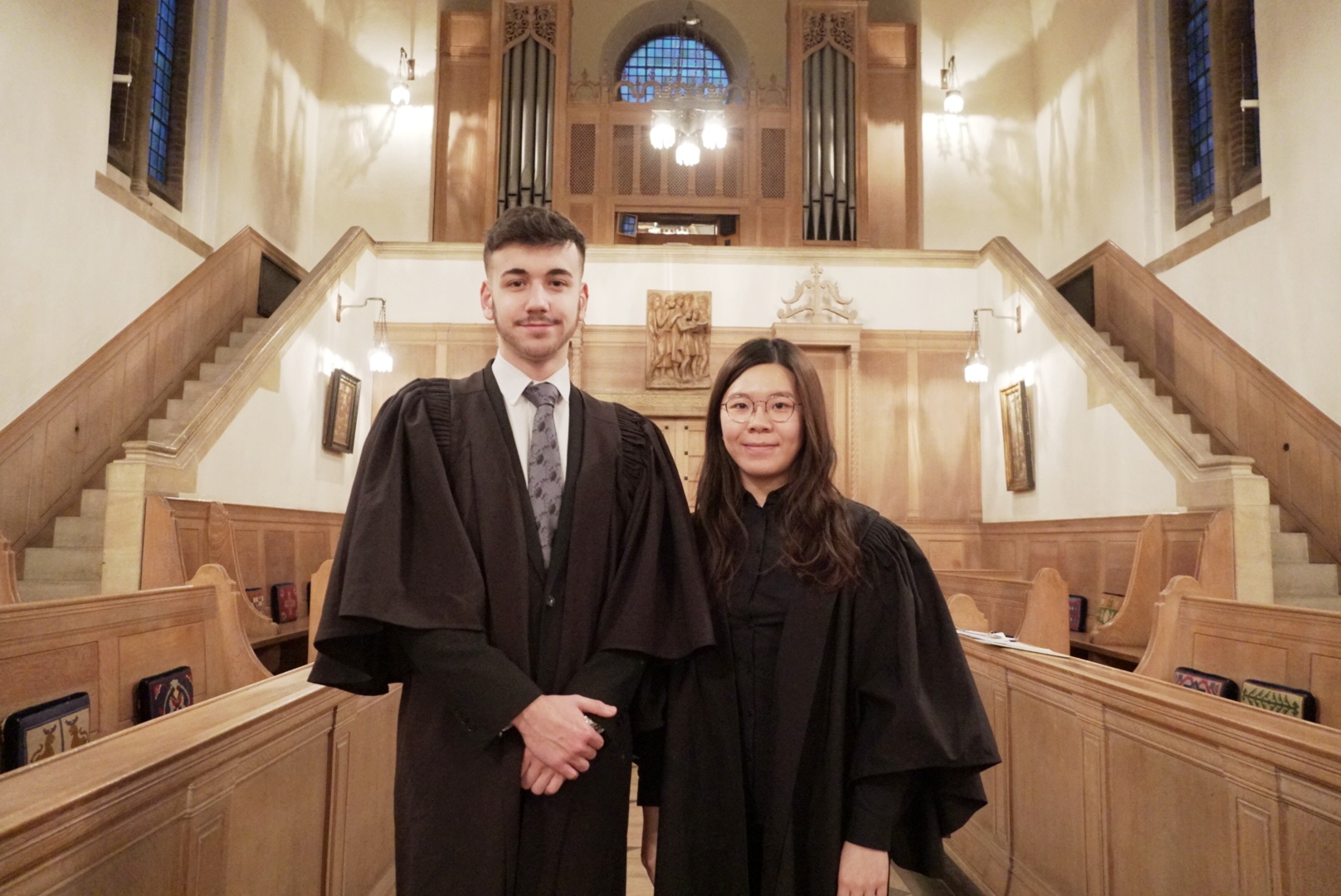 A picture of the two LMH Organ Scholars standing next to each other in the LMH Chapel.