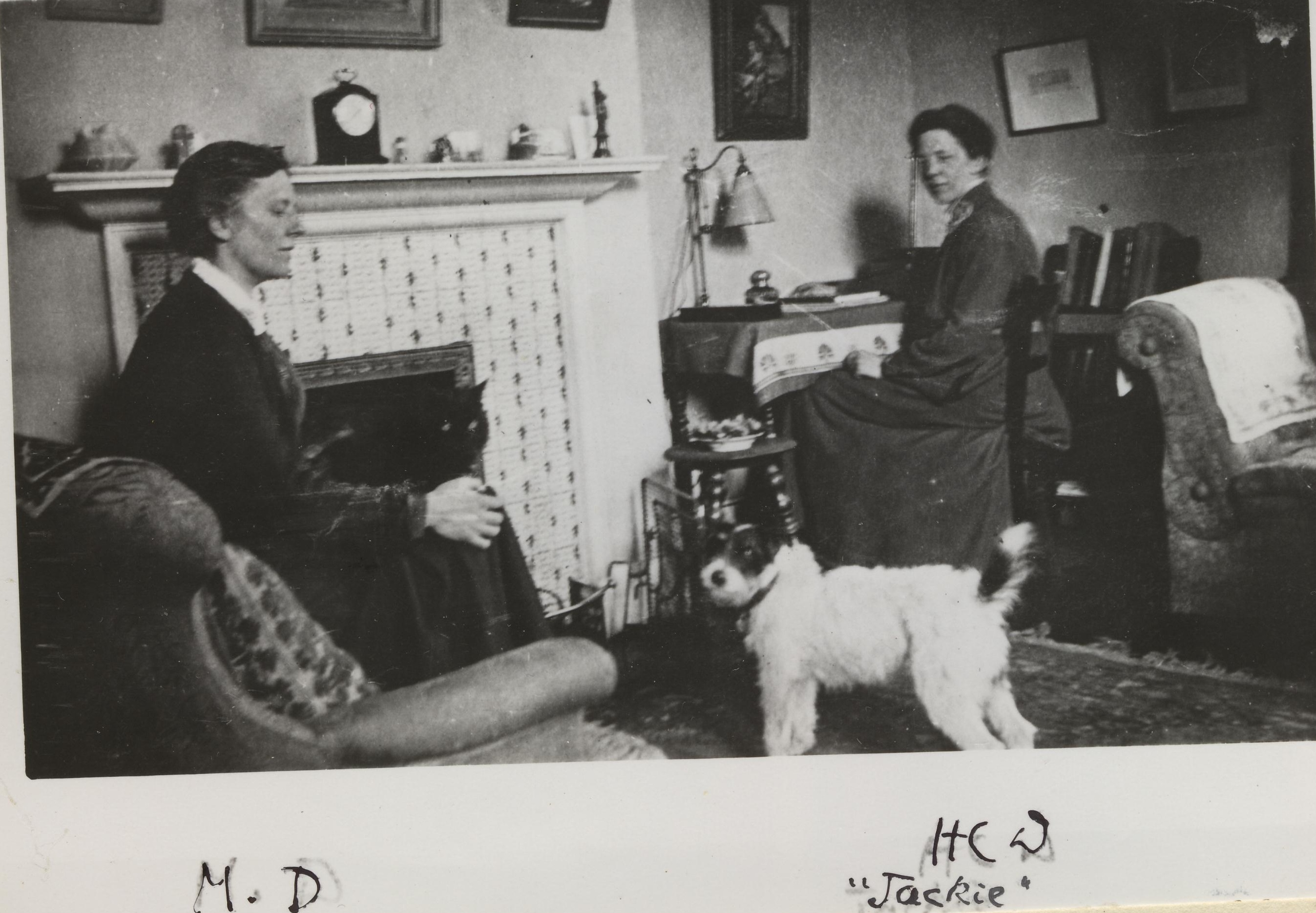 Black and white photo of Helena and Margaret Deneke and their dog