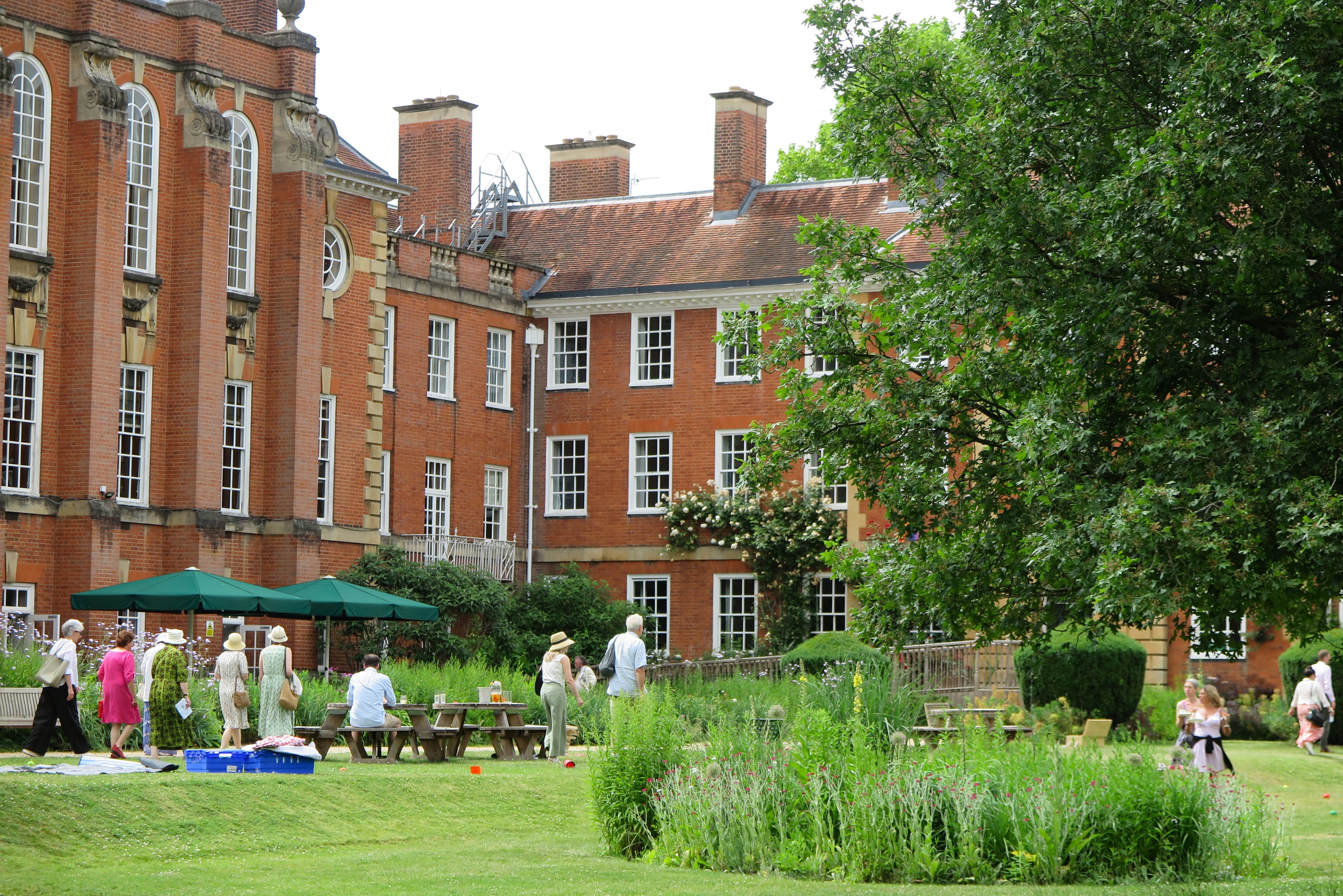 The LMH grounds filled with people going to a summer garden party