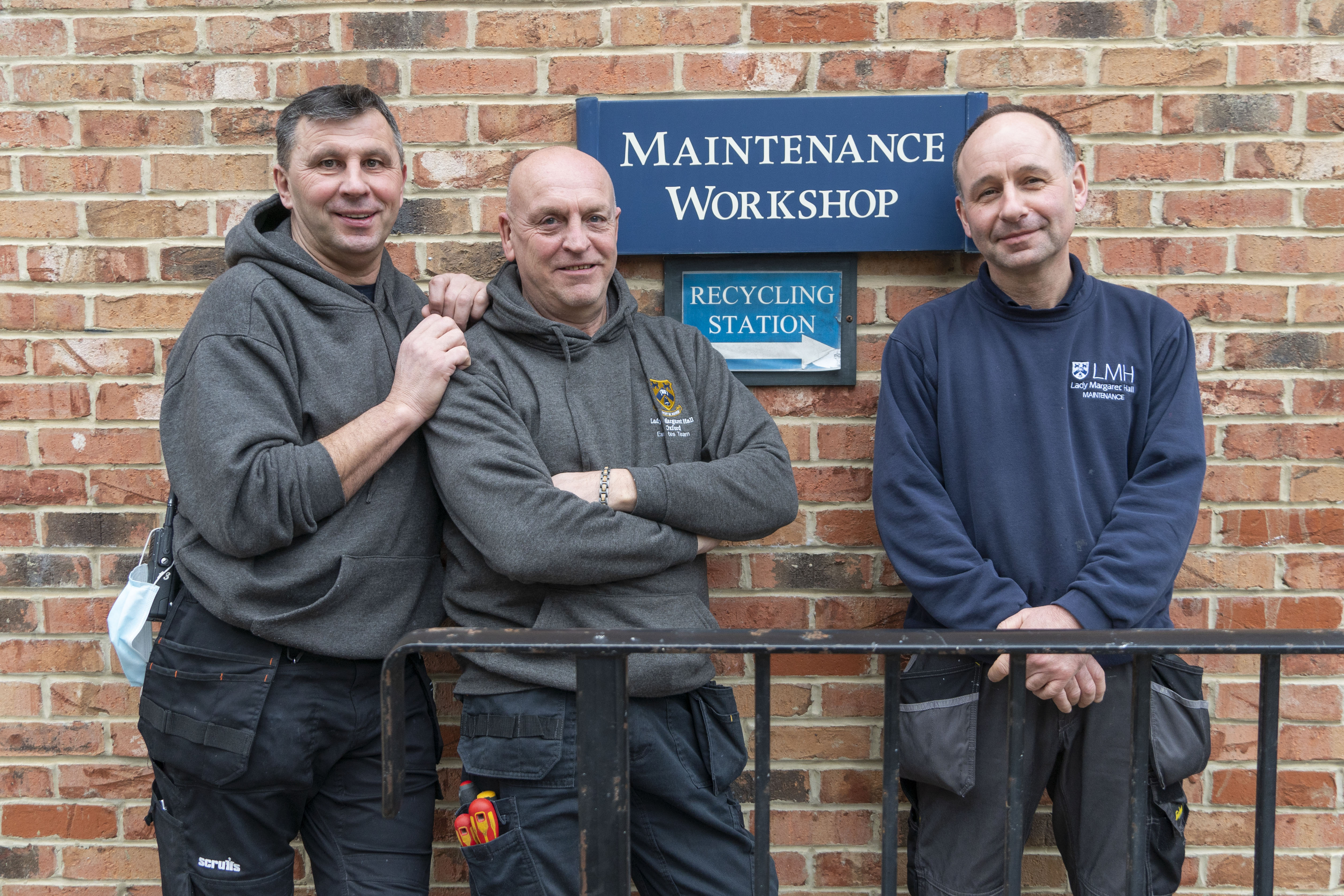 Members of the Maintenance Team standing outside the Maintenance Lodge at LMH