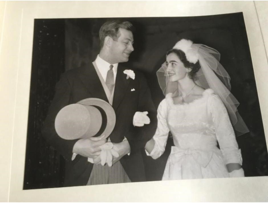 A black and white photo of a young couple getting married