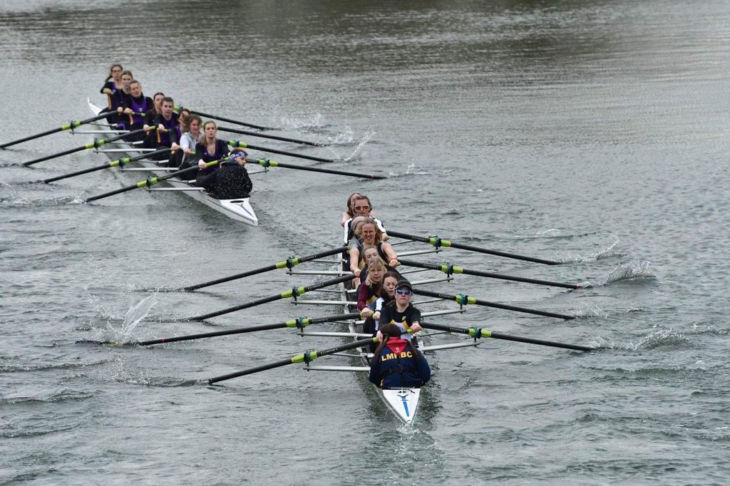 Two rowing boats and crews on the river