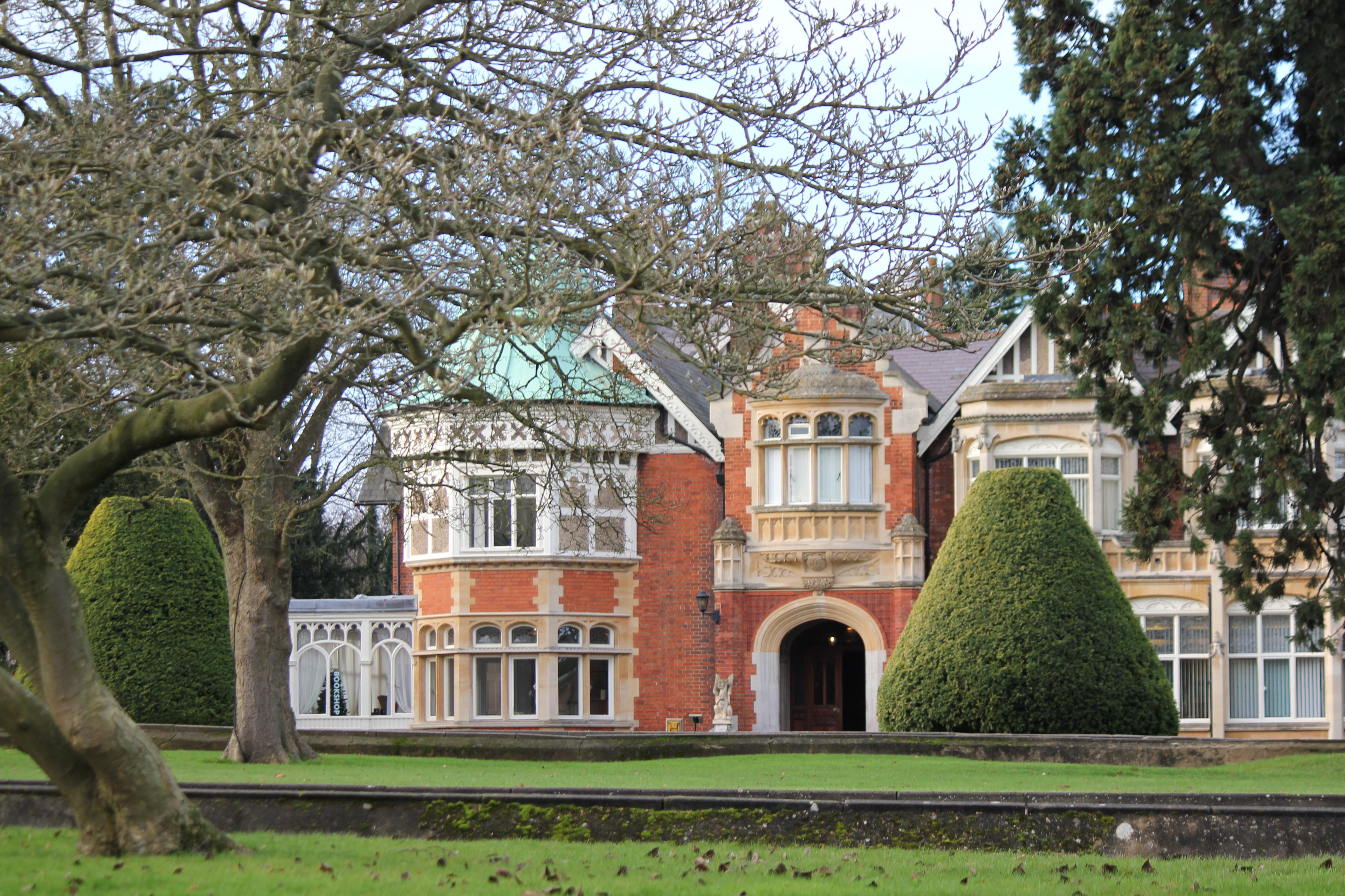 Bletchley Park, a red brick building surrounded by gardens