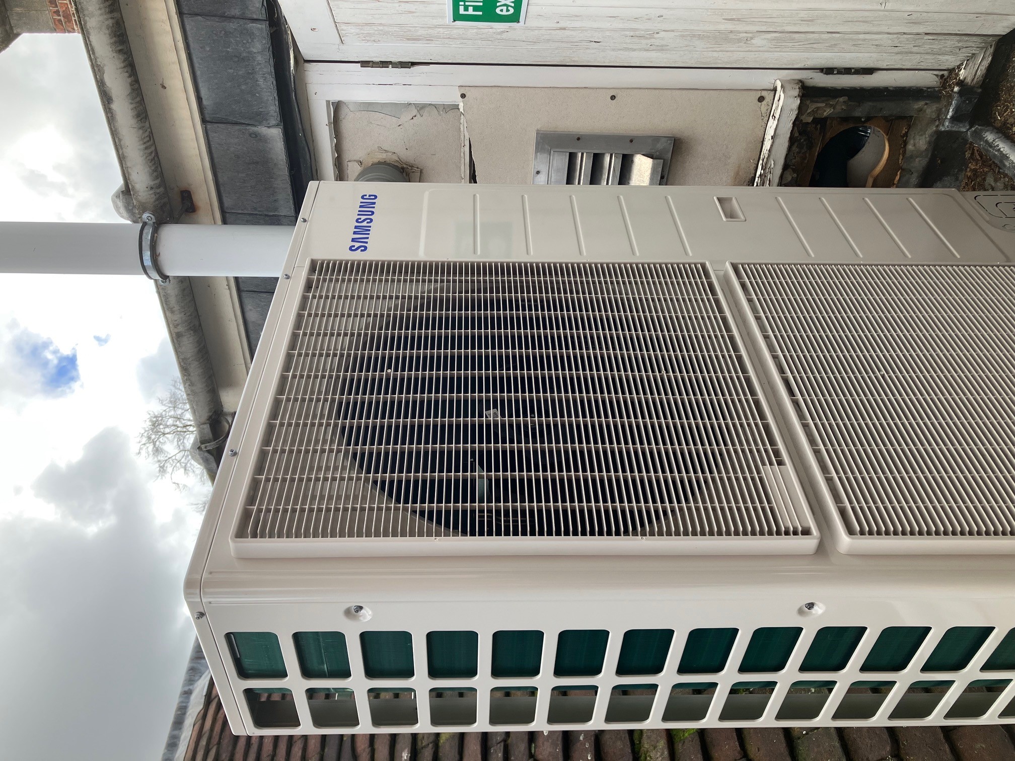 Photo of a heat pump on top of a building
