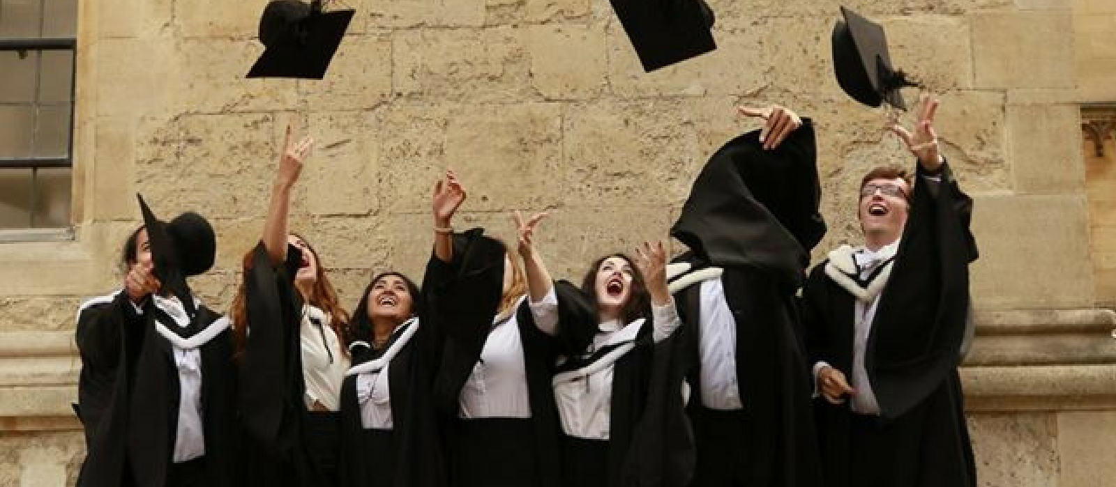 Graduates throwing their hats in the air