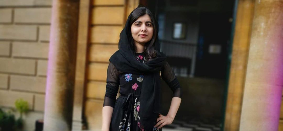 LMH alumna Malala Yousafzai standing outside Talbot Hall