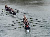 Two rowing boats and crews on the river