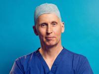 Professor Andrew Hayes dressed in his blue surgical gear