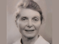 Close-up photo of Professor Margaret Matthews, who has grey hair swept back into a bun