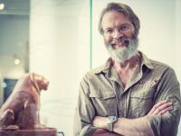 Professor David Macdonald, who has grey hair and a beard and thin silver-framed glasses