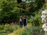 Two female students in garden