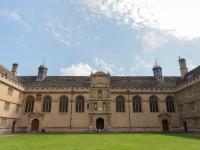 A sandstone building at Wadham College, standing in a traditional quadrangle with grass in the centre