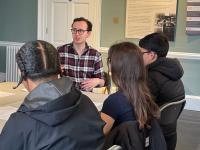 LMH academic leading a small group discussion with Year 12 students during a supercurricular session at Bruce Castle Museum.