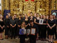 A group photo of the chapel choir in a cathedral