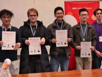Four male students holding certificates and wearing medals at the PLANCKS preliminaries 2025