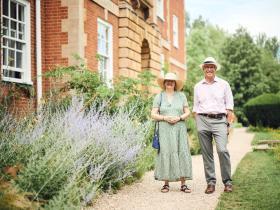 A couple walking around the gardens