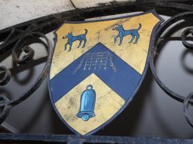 Close-up of the LMH shield, which features two Talbot hounds and a blue bell