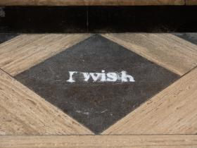 Salt on the floor of the chapel, in the shape of the words 'I wish'
