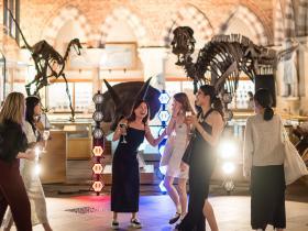 LMH students dancing with dinosaurs at the Natural History Museum
