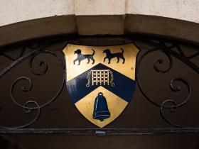 A close-up of a hand painted LMH crest