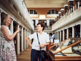 Two people in the library during the LMH150 exhibition