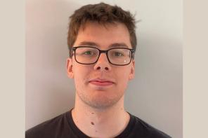 Daniel Cubbin, who has short brown hair and glasses