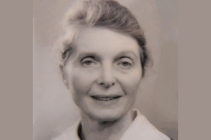 Close-up photo of Professor Margaret Matthews, who has grey hair swept back into a bun