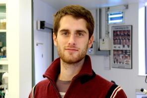 Rui Ponte Costa, who has short dark brown hair and a beard, wearing a red jumper