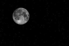 A photo of a full moon in a starry night sky