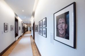 Photo of the Deneke corridor at LMH, which is lined with photographic portraits