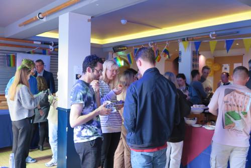 A group of students talking at an event in the LMH bar