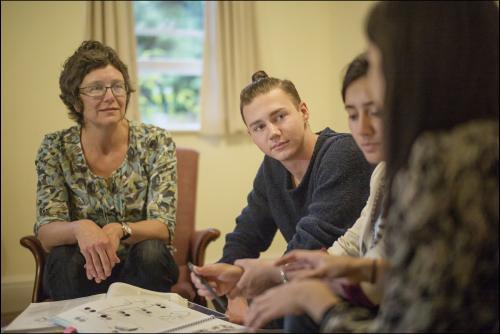 Three students in a tutorial with a Tutor