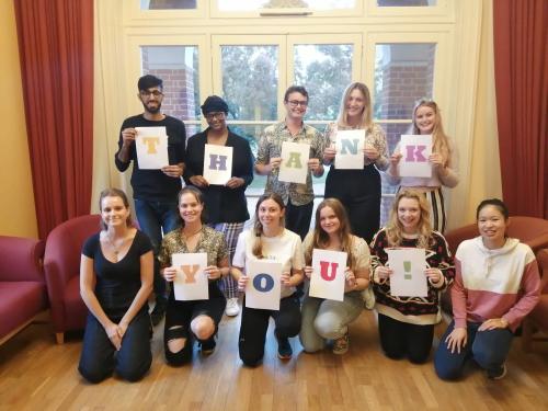 September 2019 Call Team holding pieces of paper spelling out: thank you!