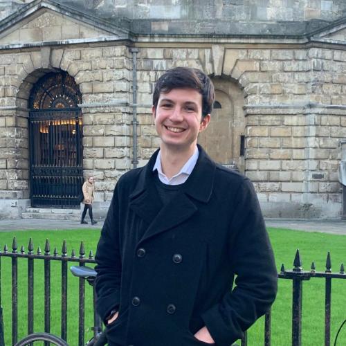 Oliver Neely standing in front of the Radcliffe Camera in Oxford