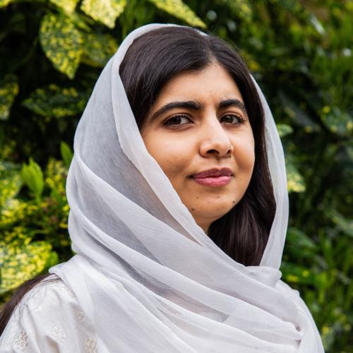 Photo of Malala Yousafzai wearing a pale grey headscarf