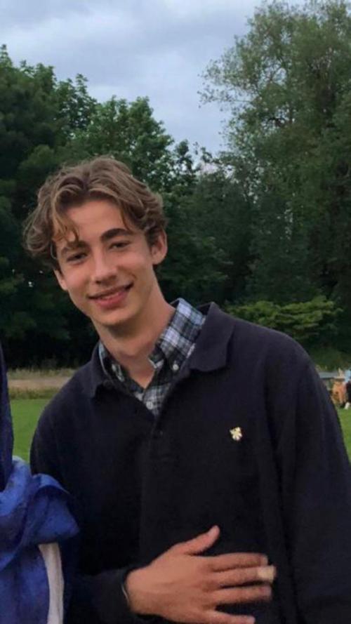 Johnnie smiling at the camera