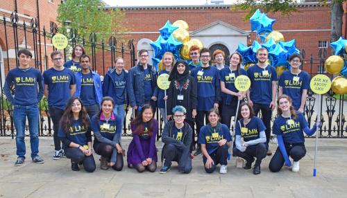 Photo of a group of student ambassadors wearing LMH t-shirts and holding balloons