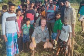 Photo of Harrison Carter and a group of local people in Tamil Nadu, India