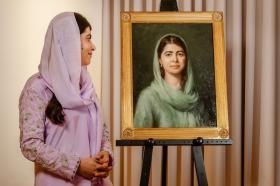 Malala stood alongside her portrait 