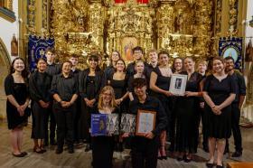 A group photo of the chapel choir in a cathedral