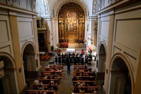 A raised view of the chapel choir performing in a cathedral