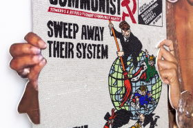 A close up of an artwork depicting the front cover of 'The Communist Magazine' made entirely out of coloured rhinestones