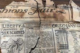 An old newspaper from April 1910 - it is discoloured and frayed around the edges