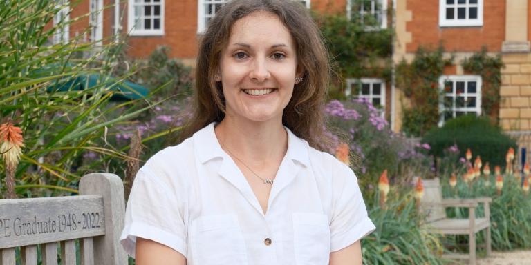 Hannie Lawlor sitting on a bench in the LMH grounds