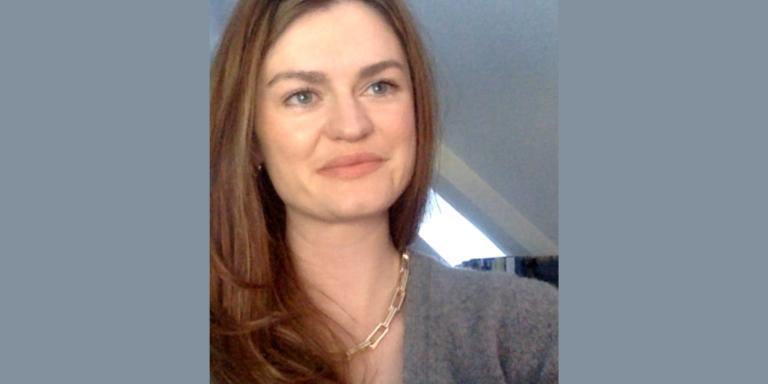 Dr Felicity Brown, who has long brown hair and is wearing a grey jumper