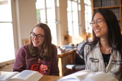 Students studying and laughing in the LMH Library